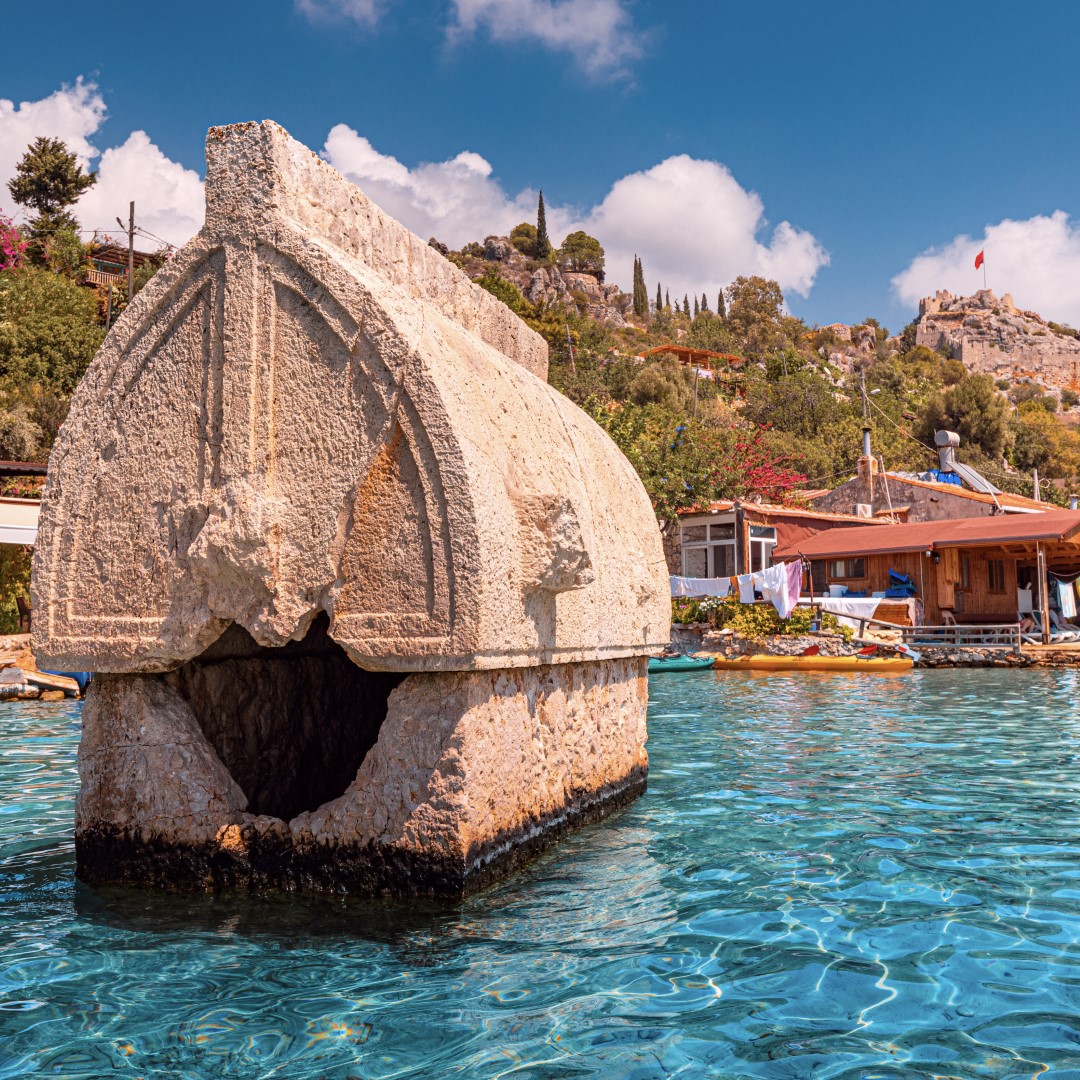Ancient sunken tomb of the Lycian Greek civilization on the shores of the Mediterranean Sea near the island of Kekova in Turkey. Travel attractions and wonders